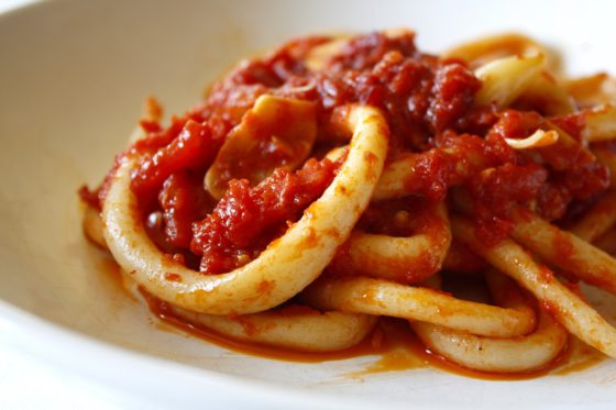 Pici all’ aglione: Tuscan pasta with tomato-garlic sauce