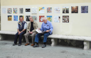 The Wall of Tiles as of June 2012 with a few locals catching up on morning news