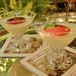 Basil and lemon infused panna cotta with strawberry sauce