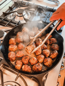 lemon meatballs cooking on the stove
